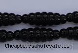 CAG1695 15.5 inches 10*30mm carved rice black agate beads