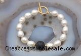 CFB978 Hand-knotted 9mm - 10mm rice white freshwater pearl & black lava bracelet